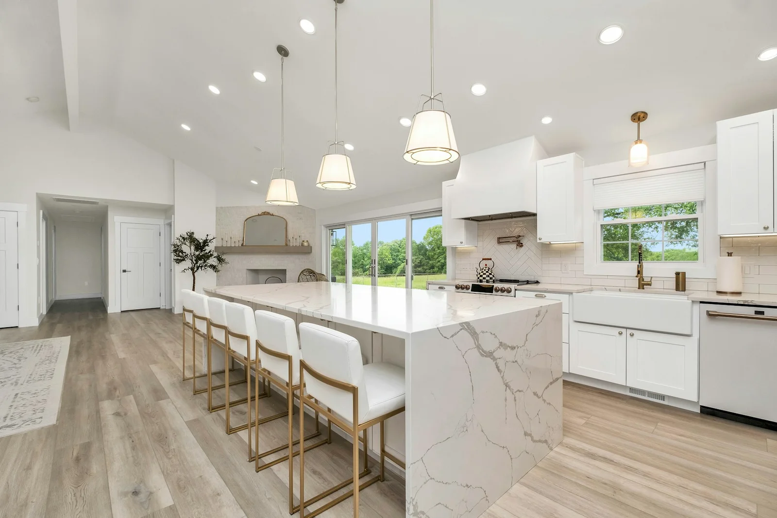 Finished kitchen with a stone countertop and backsplash